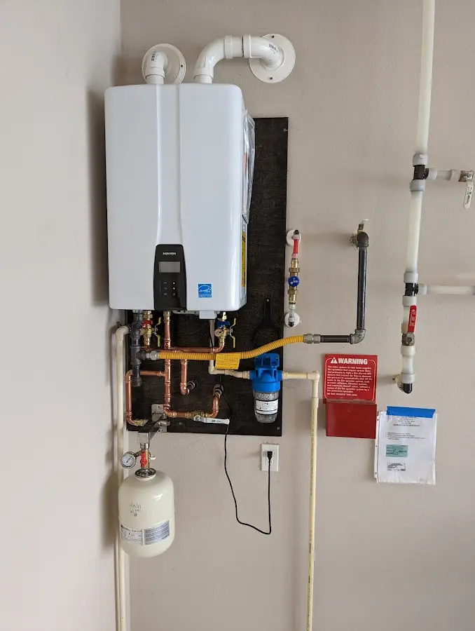 Professional plumber installing copper piping in a High Bridge home